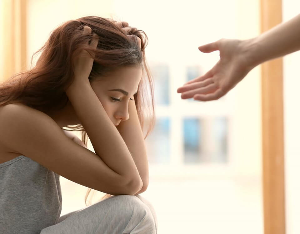 woman with hand reaching to help