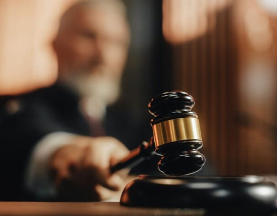 judge with gavel in courtroom